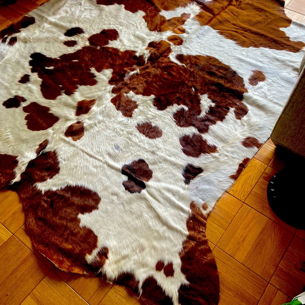 Cowhide rug with branding